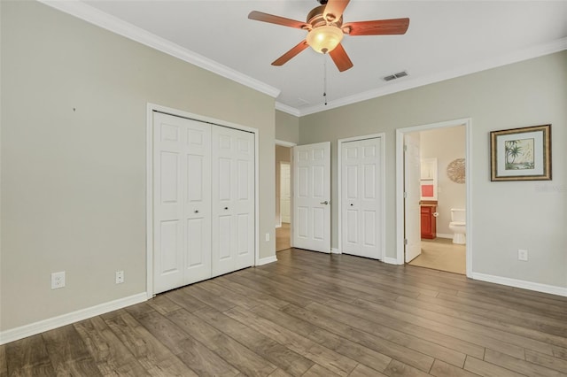 unfurnished bedroom featuring connected bathroom, ceiling fan, ornamental molding, and hardwood / wood-style flooring