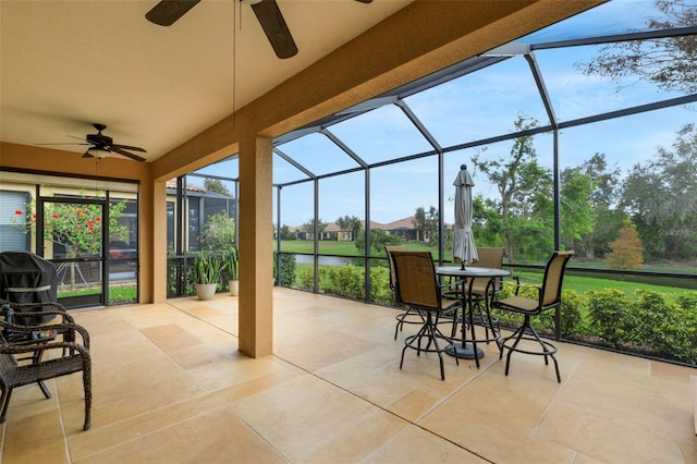 view of patio / terrace featuring a lanai and ceiling fan