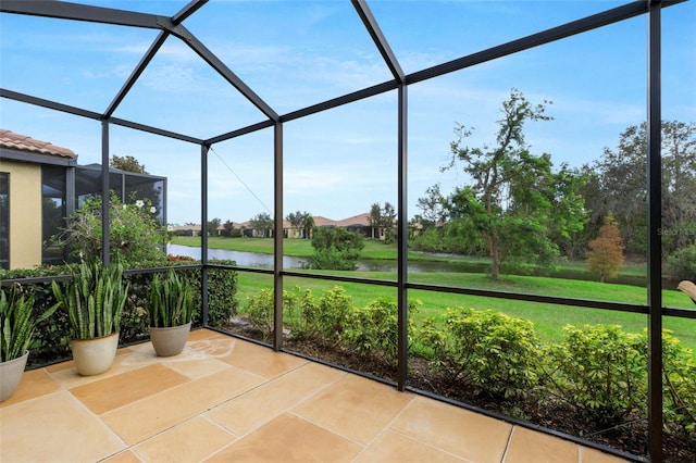 unfurnished sunroom featuring a water view and a wealth of natural light