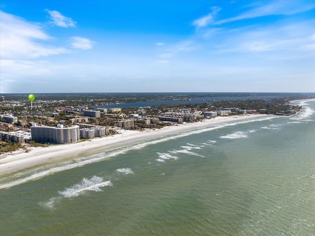 aerial view with a water view and a view of the beach