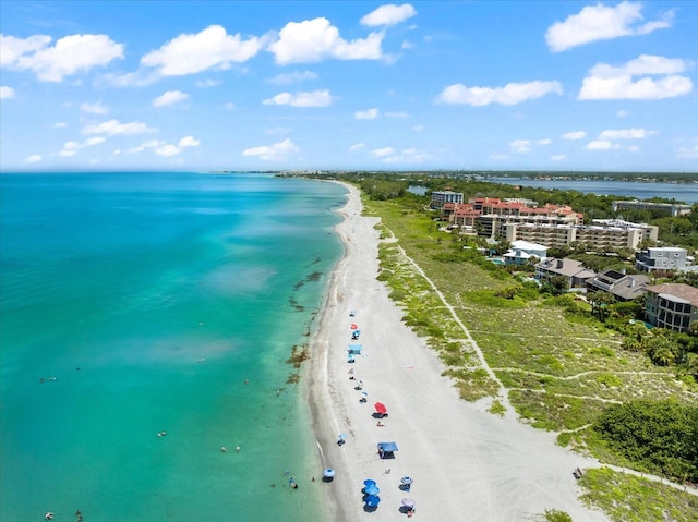 aerial view featuring a water view and a beach view