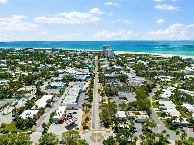 aerial view with a water view and a view of the beach