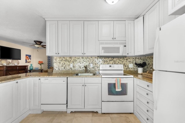 kitchen featuring white appliances, white cabinetry, ceiling fan, and sink