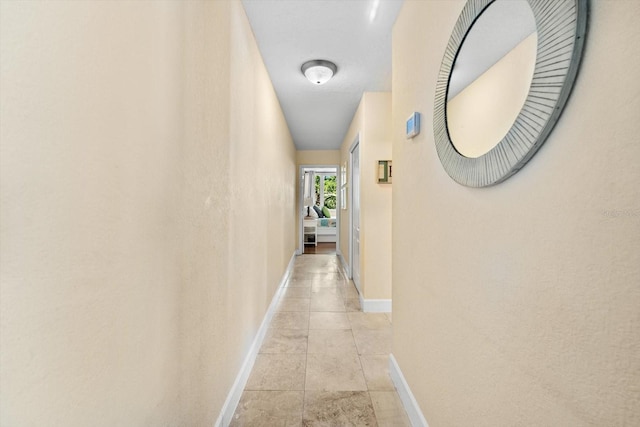 hall with light tile patterned flooring