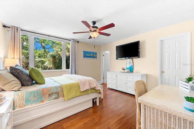 bedroom featuring ceiling fan and dark wood-type flooring