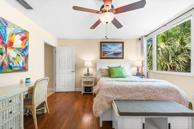 bedroom featuring ceiling fan and dark wood-type flooring