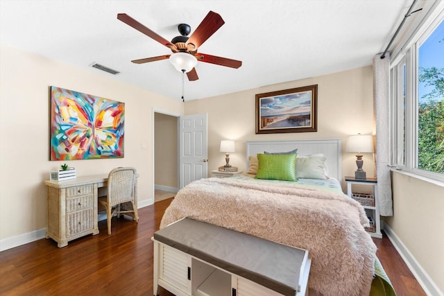 bedroom with ceiling fan and dark wood-type flooring