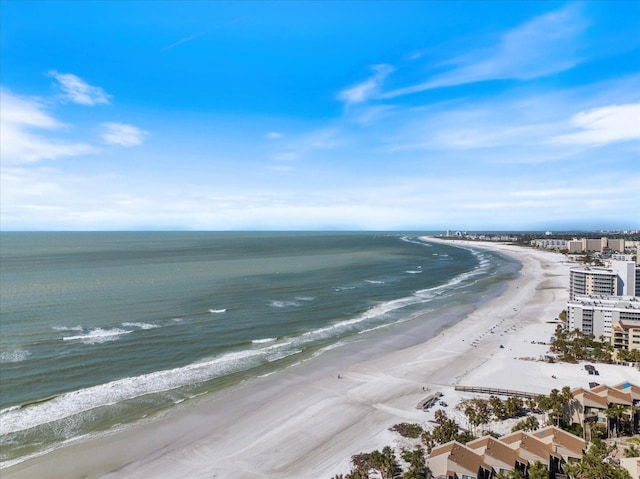 birds eye view of property with a view of the beach and a water view