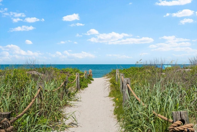 property view of water featuring a beach view