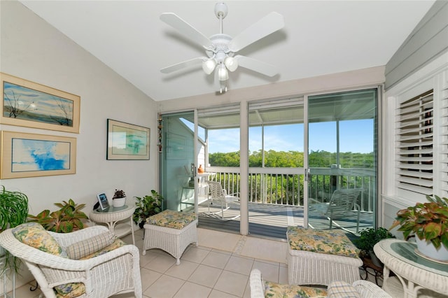 sunroom / solarium featuring ceiling fan and lofted ceiling