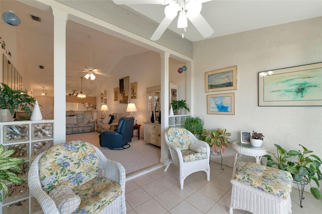 interior space with ceiling fan and vaulted ceiling