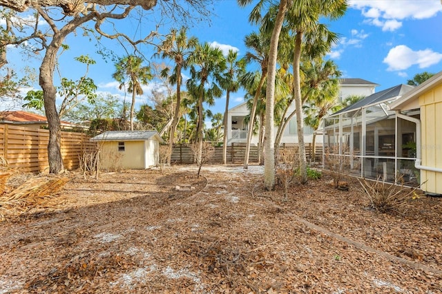 view of yard with a storage unit