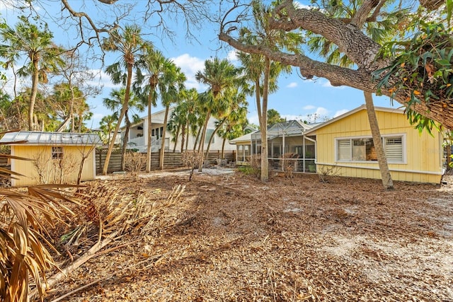 view of yard featuring glass enclosure