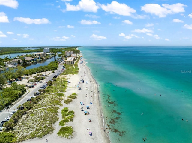 aerial view with a water view and a view of the beach