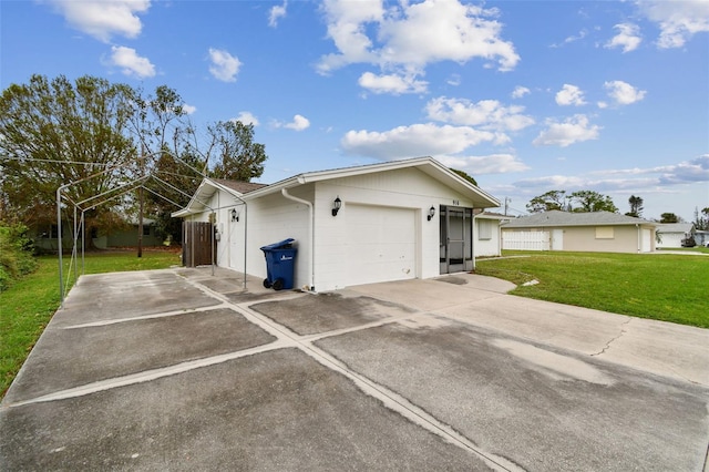 view of property exterior featuring a garage and a lawn