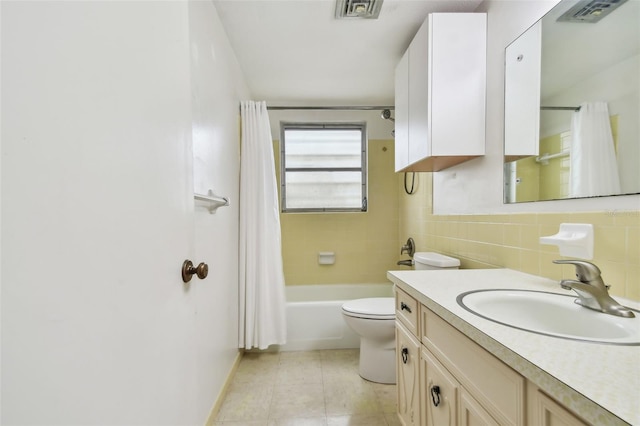 full bathroom with vanity, shower / bath combination with curtain, tile patterned flooring, toilet, and tasteful backsplash