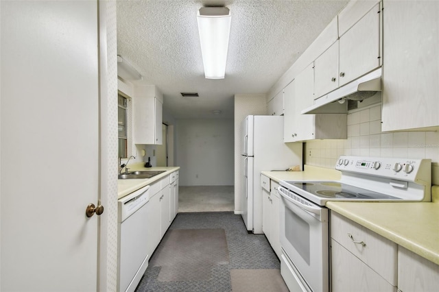 kitchen with backsplash, a textured ceiling, white appliances, sink, and white cabinetry