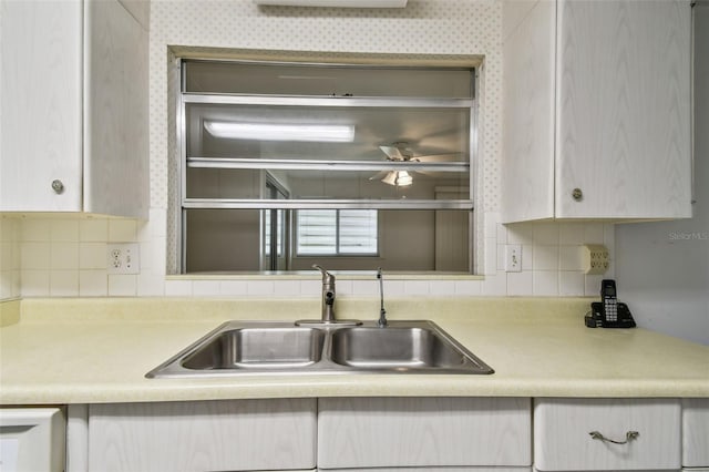 kitchen featuring backsplash and sink