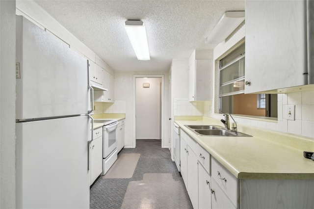 kitchen with white cabinets, decorative backsplash, white appliances, and sink