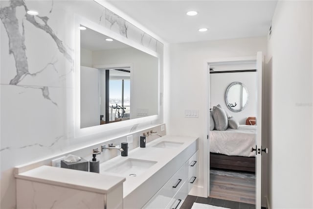 888 Blvd Of The Arts Unit 1705, Sarasota, FL 34236 - full bath with ensuite bathroom, double vanity, recessed lighting, and wood finished floors