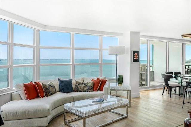 interior space featuring a water view and light hardwood / wood-style flooring