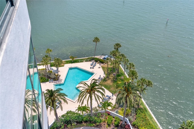 view of swimming pool with a water view