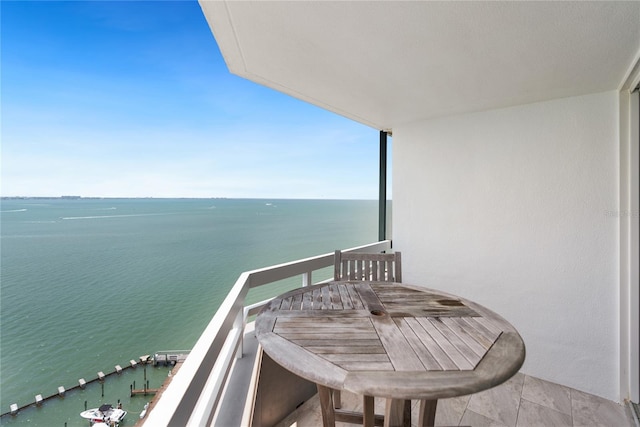 balcony featuring a water view