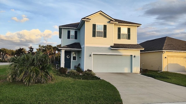 view of front property featuring a garage and a front lawn