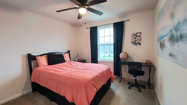 carpeted bedroom featuring baseboards and a ceiling fan