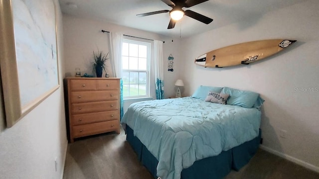 bedroom featuring carpet flooring, a ceiling fan, and baseboards