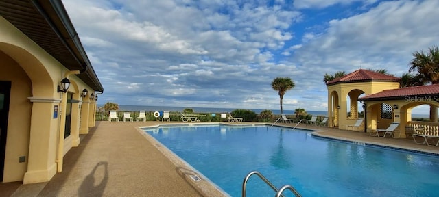 community pool featuring a patio area