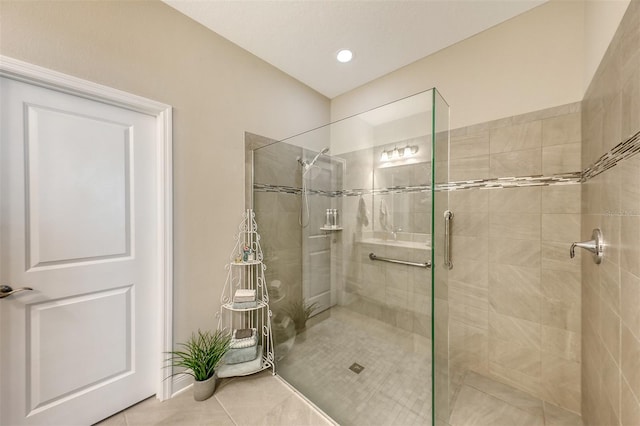 bathroom featuring tile patterned floors and walk in shower