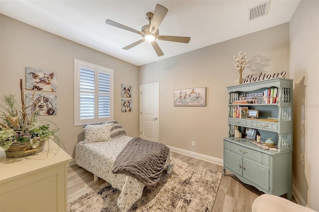 14924 Sora Way, Bradenton, FL 34212 - bedroom with light wood finished floors, ceiling fan, and baseboards