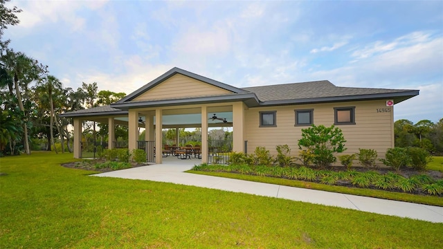 14924 Sora Way, Bradenton, FL 34212 - back of house with a ceiling fan, a lawn, and a patio