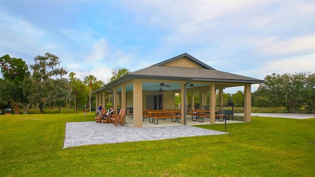 surrounding community featuring a patio and a lawn