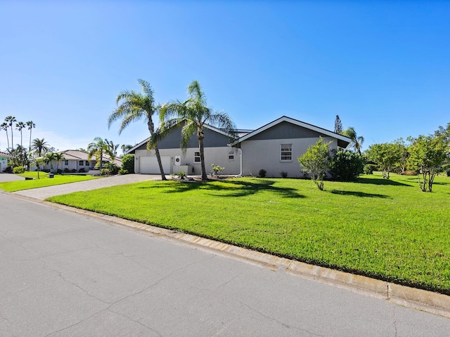 view of property exterior with a yard and a garage