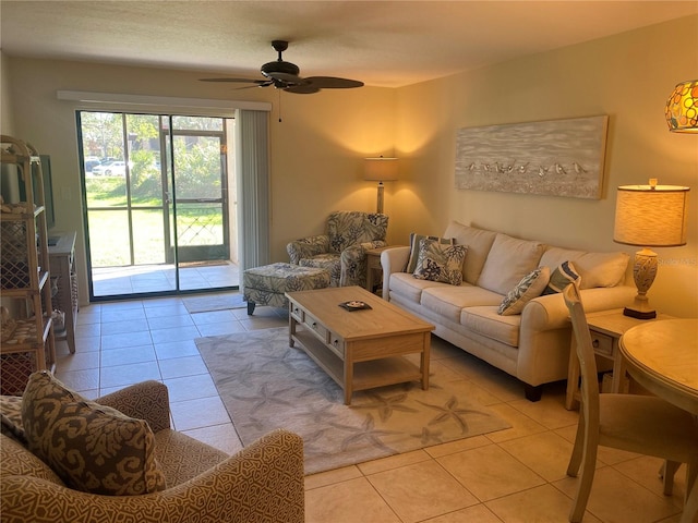 living room featuring ceiling fan and light tile patterned flooring