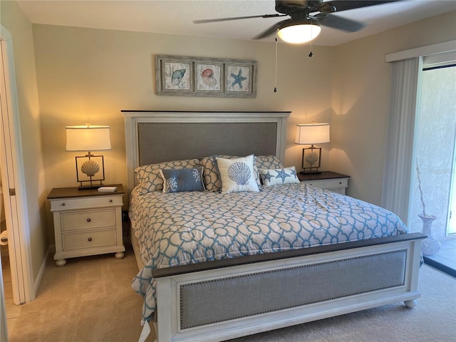 bedroom with multiple windows, light colored carpet, and ceiling fan