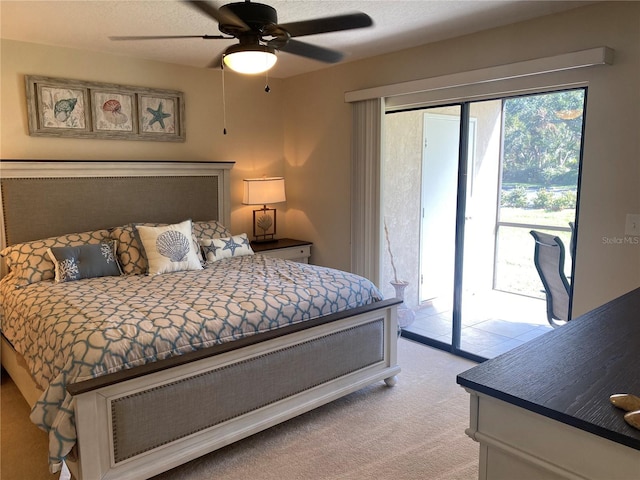 bedroom featuring ceiling fan, light colored carpet, and access to outside