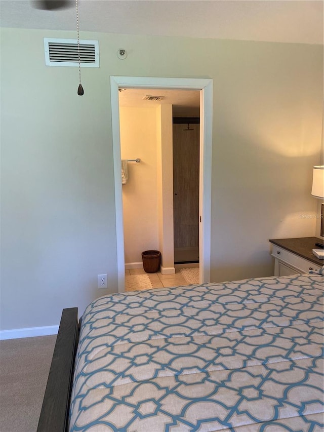 unfurnished bedroom with a closet and light colored carpet