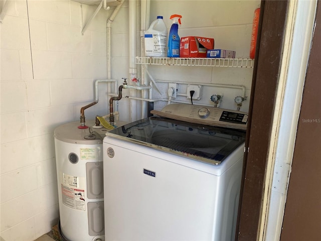 laundry room featuring washer / dryer and water heater