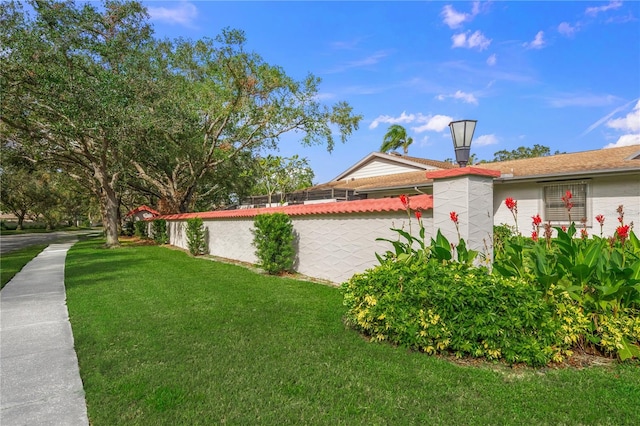 view of property exterior featuring a yard