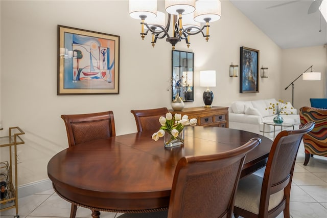 tiled dining space featuring ceiling fan with notable chandelier and vaulted ceiling