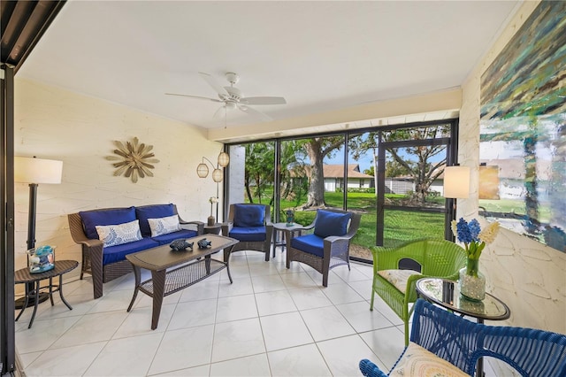 sunroom / solarium featuring ceiling fan