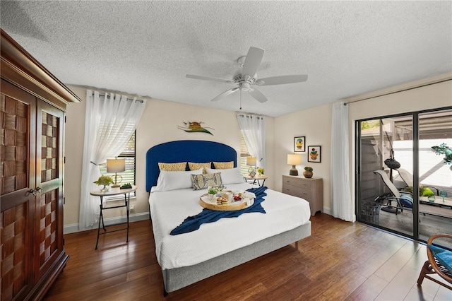 bedroom with a textured ceiling, access to outside, ceiling fan, and dark wood-type flooring