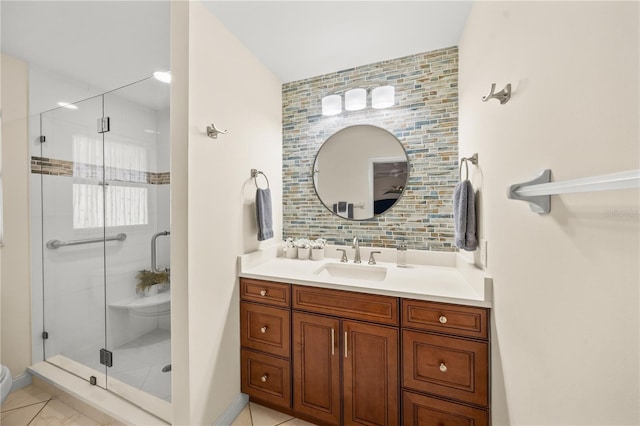 bathroom with vanity and a shower with shower door