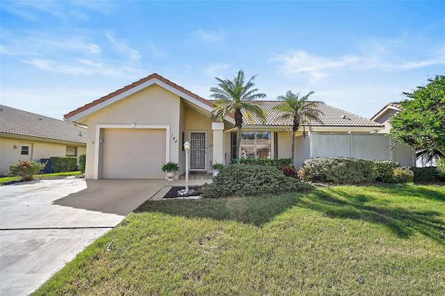 view of front of home with an attached garage, concrete driveway, a front yard, and stucco siding