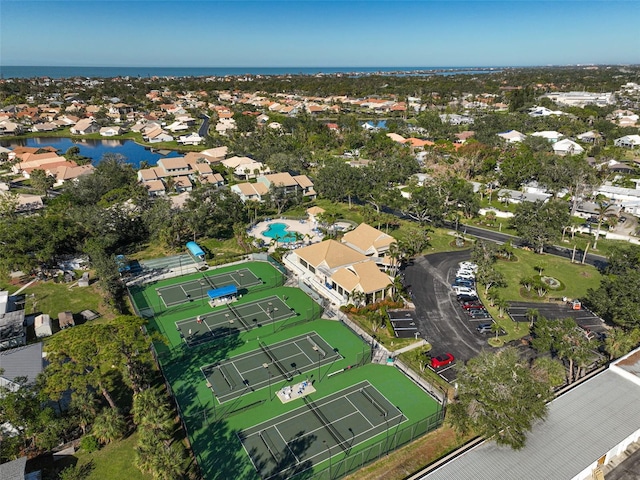 drone / aerial view featuring a residential view and a water view