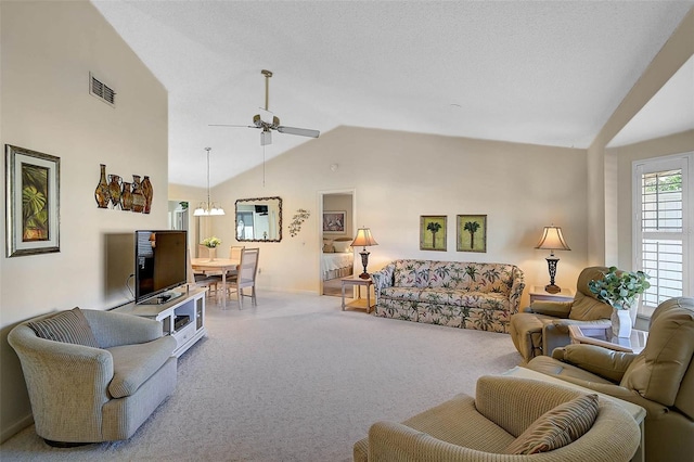 carpeted living area featuring ceiling fan, high vaulted ceiling, a textured ceiling, and visible vents