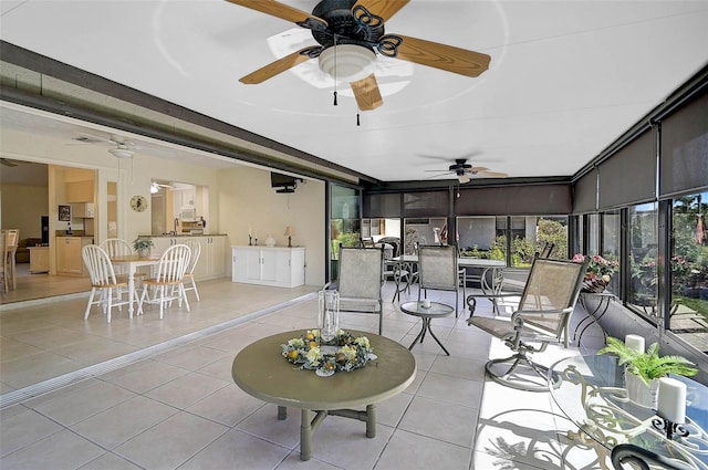 sunroom with a ceiling fan